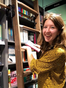 Me at my local bookshop, finding Celestial Bodies by Jokha Alharthi (tr. Marilyn Booth)